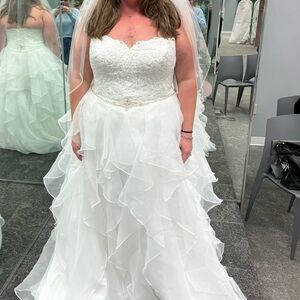 Never altered. Only worn to try on. Tags still on. Travel Gown bag included